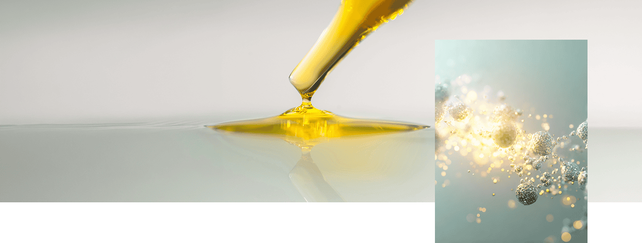 Goutte dorée et particules lumineuses evoquant les réactions inflammatoires et cellulaires